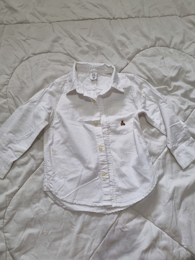 Baby Gap White Longsleeve Polo (Category: Babies & Kids Fashion) located in Quezon City. Submitted by TaraSelling (Listing ID 1382550711, Image 1). Description: Size on tag: 2yo w/ washable stains as seen on photos, due to storage. Hence, selling low..