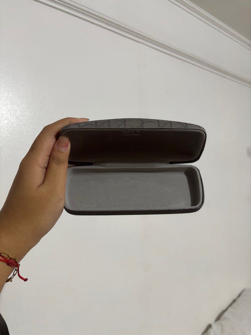 Calvin Klein Glasses Case Holder (Category: Vision Care) located in Marikina City. Submitted by everythingisnegotiable (Listing ID 1382531484, Image 3). Description: Original Calvin Klein glasses case that I got with my glasses before. Really liked this because it wasnt that round which made it compact for bags 🫶🏽 no stains or tears.
