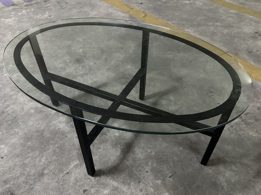 Coffee table (Category: Coffee & Tea Tableware) located in Quezon City. Submitted by bmblniiii (Listing ID 1382573654, Image 1). Description: Tempered glass top & metal frame .