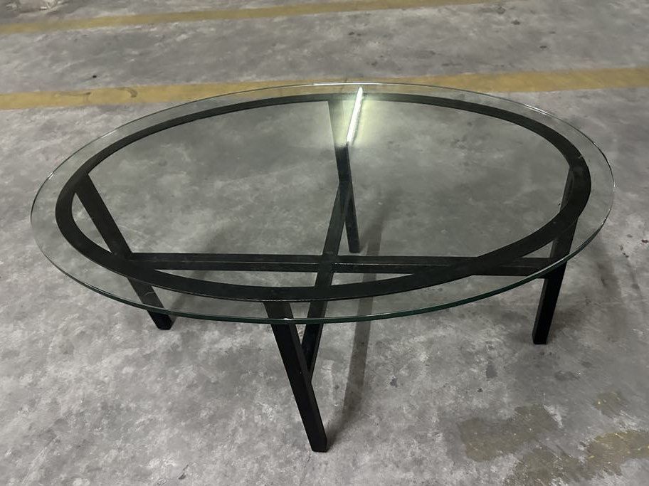 Coffee table (Category: Coffee & Tea Tableware) located in Quezon City. Submitted by bmblniiii (Listing ID 1382573654, Image 2). Description: Tempered glass top & metal frame .