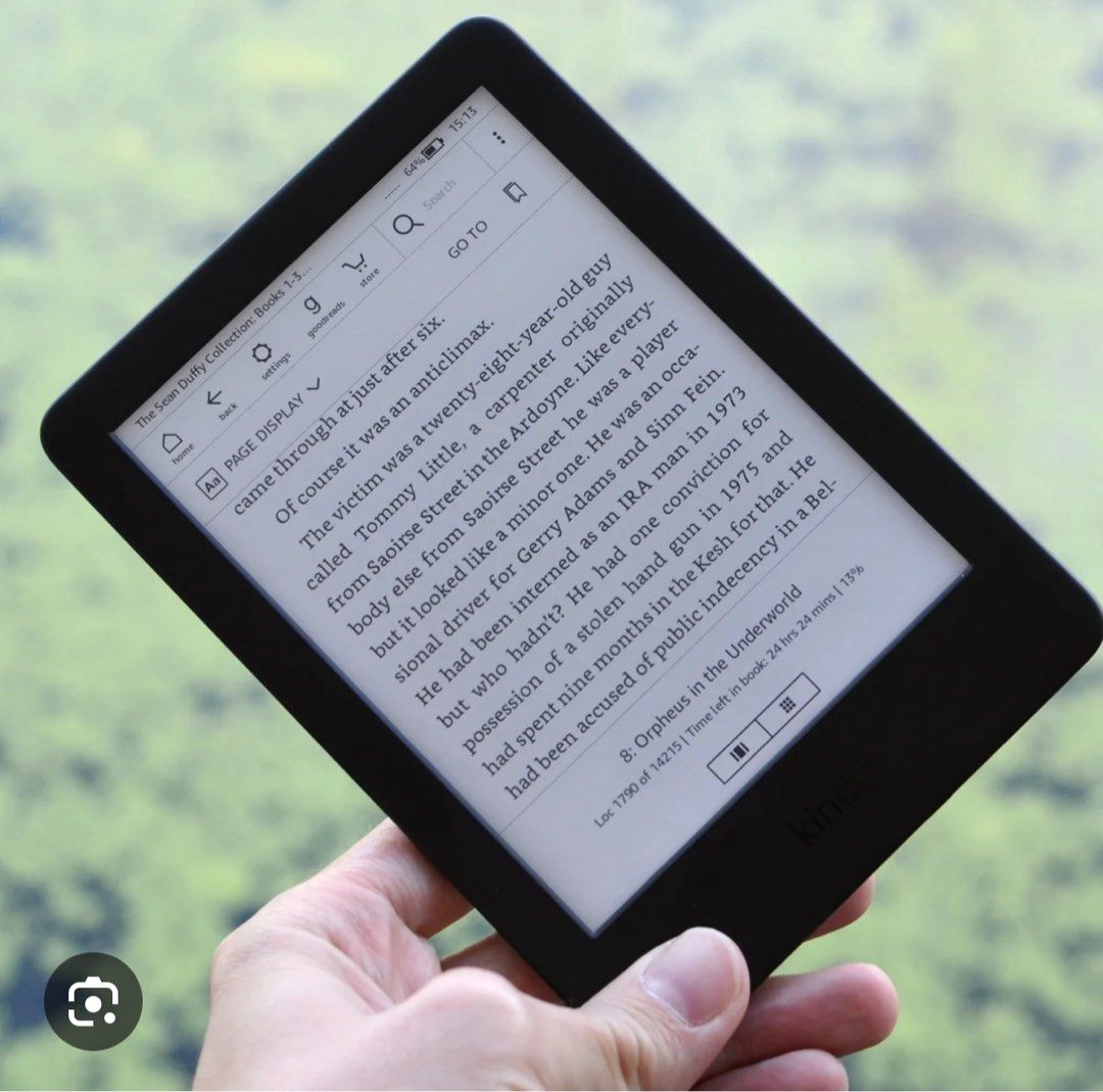 Kindle E-reader (Category: E-Readers) located in Singapore. Submitted by terence_chong_7 (Listing ID 1382524714, Image 1). Description: Perfect for reading on the go. Features a clear display and long battery life. Enjoy your favorite books anytime, anywhere. The screen shows a book from the Sean Duffy Collection..