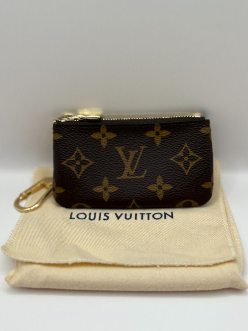 Louis Vuitton LV Pochette Cles Key Pouch Monogram Wallet (Category: Luxury Bags & Wallets) located in Manila. Submitted by summercookie (Listing ID 1382540556, Image 1). Description: Louis Vuitton Pochette Cles Key Pouch Monogram Brand New / Unused RARE ITEM Complete inclusions Made in France 12 x 7 x 1.5 cm (Length x height x width ) Monogram coated canvas Grained cowhide-leather lining Gold-color hardware Zip closure Key ring Chain with hook.