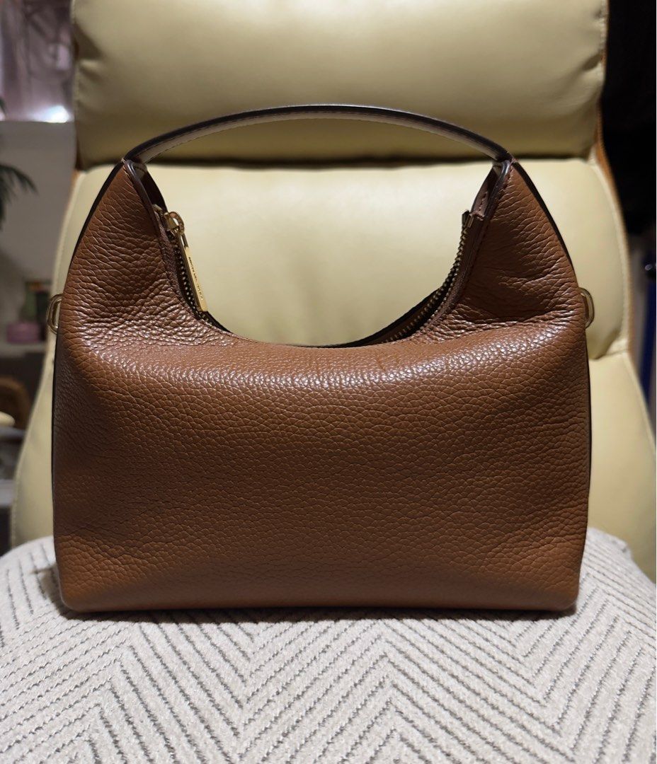 Michael Kors Ember Petite Pebble Brown Bag (Category: Luxury Bags & Wallets) located in Quezon City. Submitted by crissy_08 (Listing ID 1382515235, Image 2). Description: ❤️Perfect for Gala and Events ❤️Fashionable and Very Cutesy!! ❤️Functional with a style ❤️Love this bag but I have to let it go and give it to its 2nd Home ❤️Hand, Shoulder and Crossbody Bag ❤️Authentic 2-Way MK Bag ❤️Used with care, no scratches ❤️Condition: 10/10 ❤️Slightly Ne