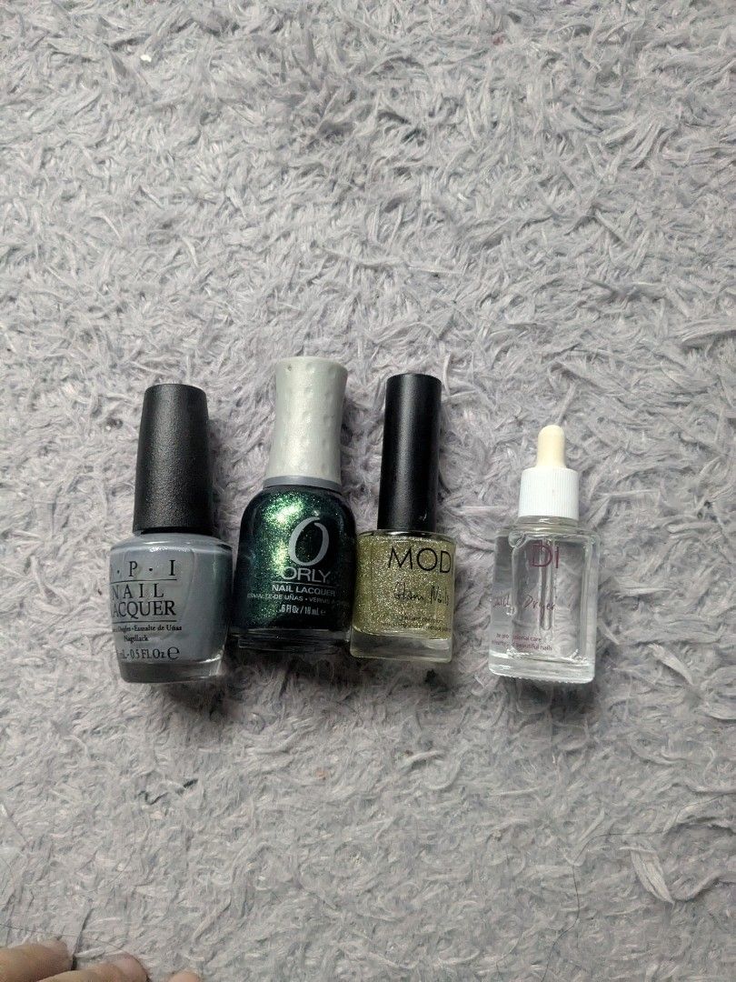Original Orly, Modi Opi Nail Polish (Category: Hands & Nails) located in Quezon City. Submitted by nnncorner (Listing ID 1382591467, Image 1). Description: Original Orly, Modi and Opi Nail Polish sold as bundle onl OPI Nail Lacquer Gray 90% content (690 og) Orly Nail Lacquer Glitter Green 90 % content (585og) Modi Glitter Transparent 90% content (489og) original bought for these 3 in total 1,700+ with free Liquid Cuticle Dryer All original! selli