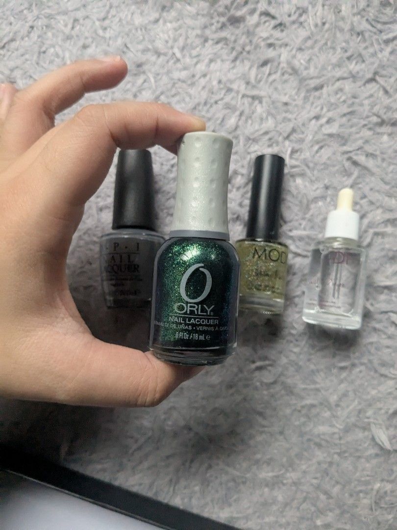 Original Orly, Modi Opi Nail Polish (Category: Hands & Nails) located in Quezon City. Submitted by nnncorner (Listing ID 1382591467, Image 2). Description: Original Orly, Modi and Opi Nail Polish sold as bundle onl OPI Nail Lacquer Gray 90% content (690 og) Orly Nail Lacquer Glitter Green 90 % content (585og) Modi Glitter Transparent 90% content (489og) original bought for these 3 in total 1,700+ with free Liquid Cuticle Dryer All original! selli