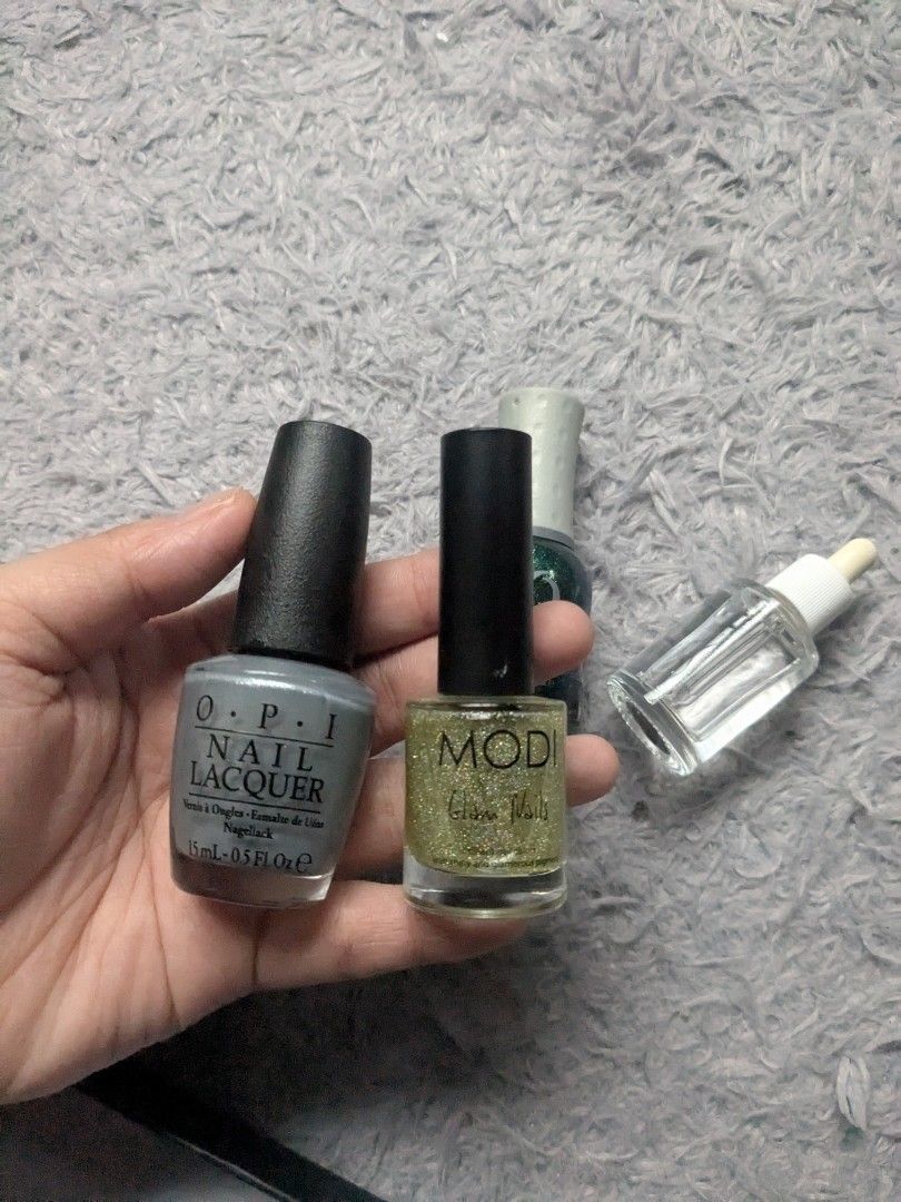 Original Orly, Modi Opi Nail Polish (Category: Hands & Nails) located in Quezon City. Submitted by nnncorner (Listing ID 1382591467, Image 3). Description: Original Orly, Modi and Opi Nail Polish sold as bundle onl OPI Nail Lacquer Gray 90% content (690 og) Orly Nail Lacquer Glitter Green 90 % content (585og) Modi Glitter Transparent 90% content (489og) original bought for these 3 in total 1,700+ with free Liquid Cuticle Dryer All original! selli