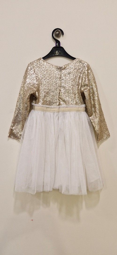 Party dress (Category: Babies & Kids Fashion) located in Kuala Lumpur. Submitted by peihwa7 (Listing ID 1382559883, Image 2). Description: Golden beige party dress. Sequins are intact..