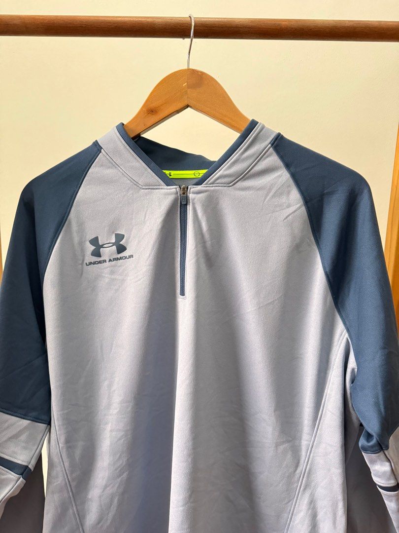 Under Armour Quarter-Zip Long Sleeve Pullover (Category: Coats, Jackets and Outerwear) located in Makati City. Submitted by thiftdirection (Listing ID 1382496116, Image 2). Description: Under Armour Quarter-Zip Long Sleeve Pullover Elevate your performance and your look with this sleek Under Armour long-sleeve athletic pullover. Designed with a sharp combination of light gray and navy blue, this piece offers both comfort and style for your workou