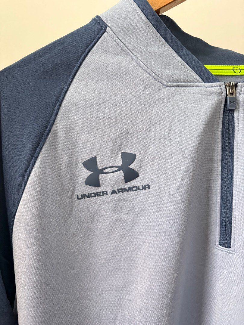 Under Armour Quarter-Zip Long Sleeve Pullover (Category: Coats, Jackets and Outerwear) located in Makati City. Submitted by thiftdirection (Listing ID 1382496116, Image 3). Description: Under Armour Quarter-Zip Long Sleeve Pullover Elevate your performance and your look with this sleek Under Armour long-sleeve athletic pullover. Designed with a sharp combination of light gray and navy blue, this piece offers both comfort and style for your workou