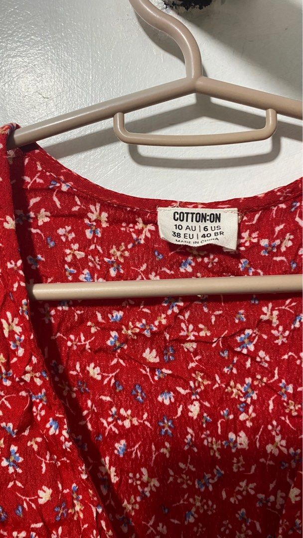 COTTON ON v-neck dress (Category: Dresses) located in Malay. Submitted by spacetrips (Listing ID 1382756087, Image 2). Description: COTTON ON Red floral dress with ruffled sleeves, a V-neckline, and an elasticated or gathered waist. Mini or knee-length dress with a flowy silhouette. +100 sf.