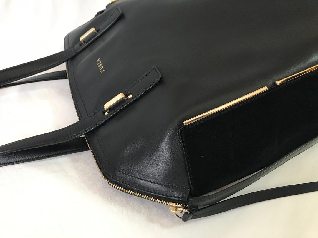 FURLA BLACK LARGE LEATHER DOME BAG (Category: Luxury Bags & Wallets) located in Paranaque City. Submitted by buttonbabies (Listing ID 1382742521, Image 3). Description: Used only a few times with minor flaws (wrinkling on sides) due to storage. Still very nice. Length on Base - 12 inches Width on Base - 6 inches Height - 12.5 inches Stap drop - 7.5 inches Cash payment, Gcash or BPI/BDO bank transfer. Prefer to meet up in BF Homes Paranaque. OR De