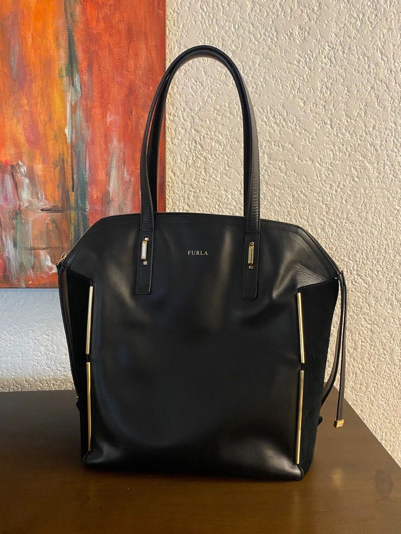 FURLA BLACK LARGE LEATHER DOME BAG (Category: Luxury Bags & Wallets) located in Paranaque City. Submitted by buttonbabies (Listing ID 1382742521, Image 1). Description: Used only a few times with minor flaws (wrinkling on sides) due to storage. Still very nice. Length on Base - 12 inches Width on Base - 6 inches Height - 12.5 inches Stap drop - 7.5 inches Cash payment, Gcash or BPI/BDO bank transfer. Prefer to meet up in BF Homes Paranaque. OR De