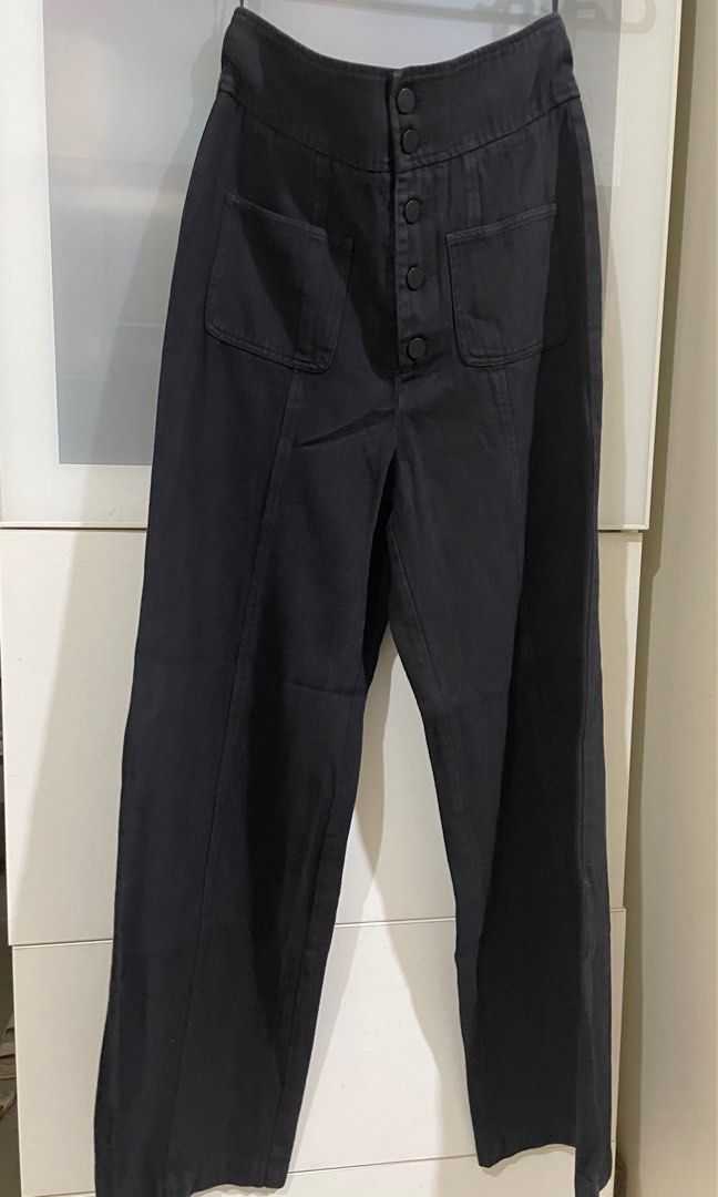 High waist wide leg pants (Category: Other Bottoms) located in Taguig. Submitted by lam_decluttering (Listing ID 1382774844, Image 1). Description: Black soft denim high waist pants waist - 25 inches Length - 40 inches Rise - 13 inches.