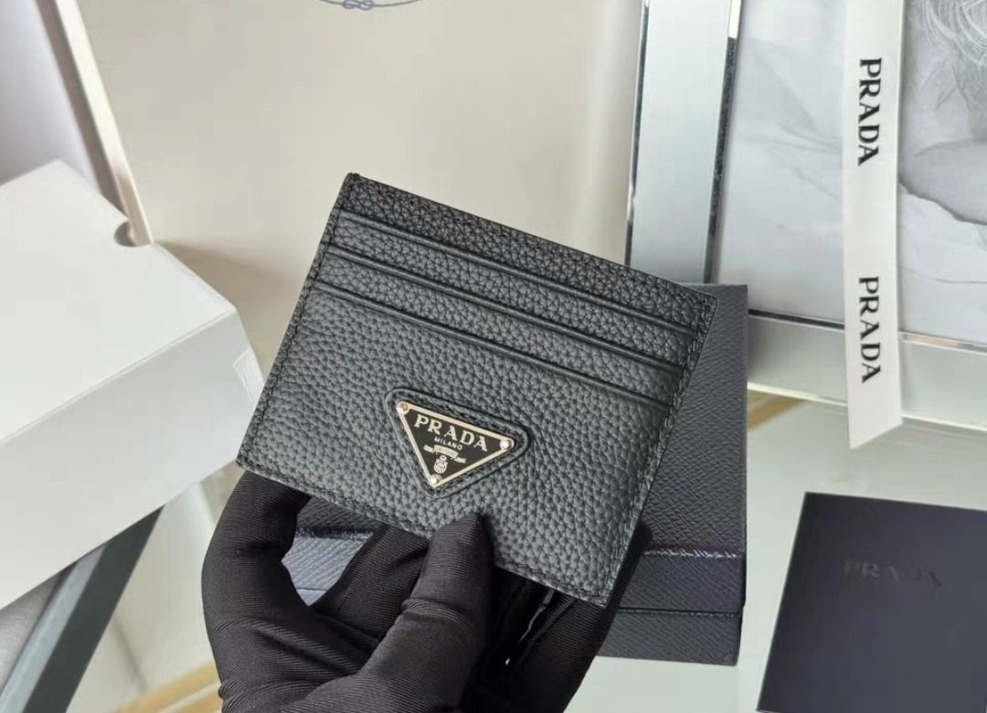 Prada Leather Card Holder (Category: Luxury Bags & Wallets) located in Manila. Submitted by closett_plug (Listing ID 1382700719, Image 2). Description: Main materials: Deer Grain Leather, Enamel metal appliques Size: Length 10cm Height 8cm - Pre-order 7-10 Days ETA ( consolidated box ) - 50% deposit required - I get these from overseas, strictly no cancellation, return & refund - Refrain from chatting if you have doubts, let's not waste each othe