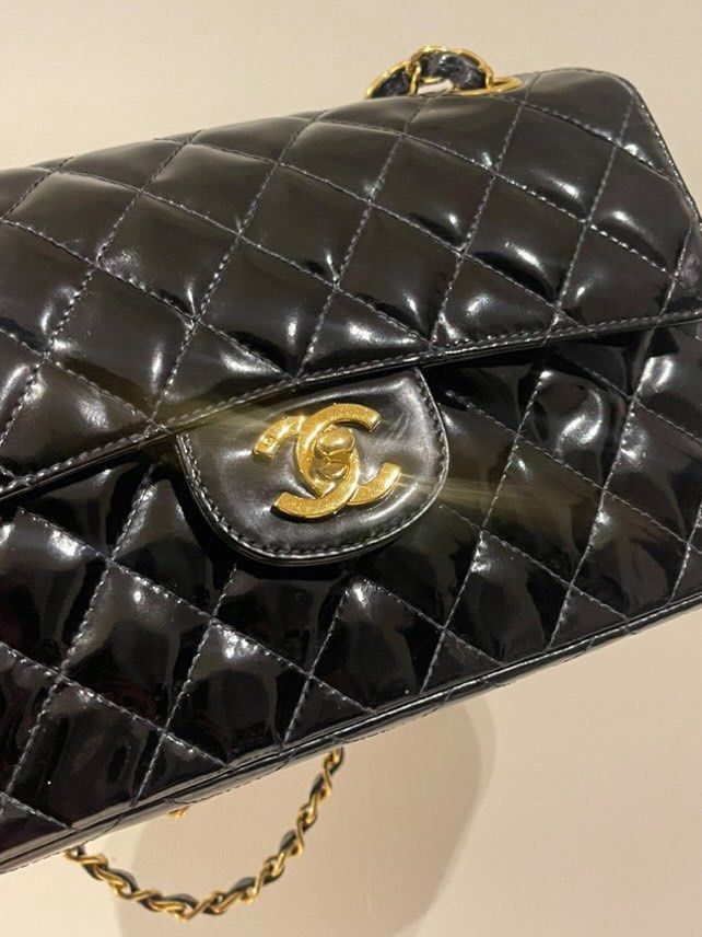 Rare Authentic Chanel Double Faced Flap Small Size (Category: Luxury Bags & Wallets) located in Manila. Submitted by beaumontandco (Listing ID 1382828727, Image 2). Description: Rare find! With dustbag and entrupy! Chanel double faced flap Vintage Patent leather Pm for more photos.