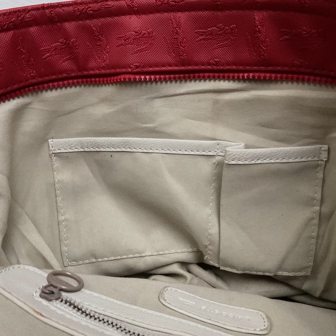 Red Lacoste Tote Bag (Category: Tote Bags) located in Taguig. Submitted by agsrx (Listing ID 1382833734, Image 3). Description: can fit a 13in laptop! Includes a zipper pocket + 2 other pockets for smaller items issue: small stain on the inside 😢 can be washed! rfs: decluttering MOP: GCash Shipping fee not included 🚛: Grab or Lalamove.