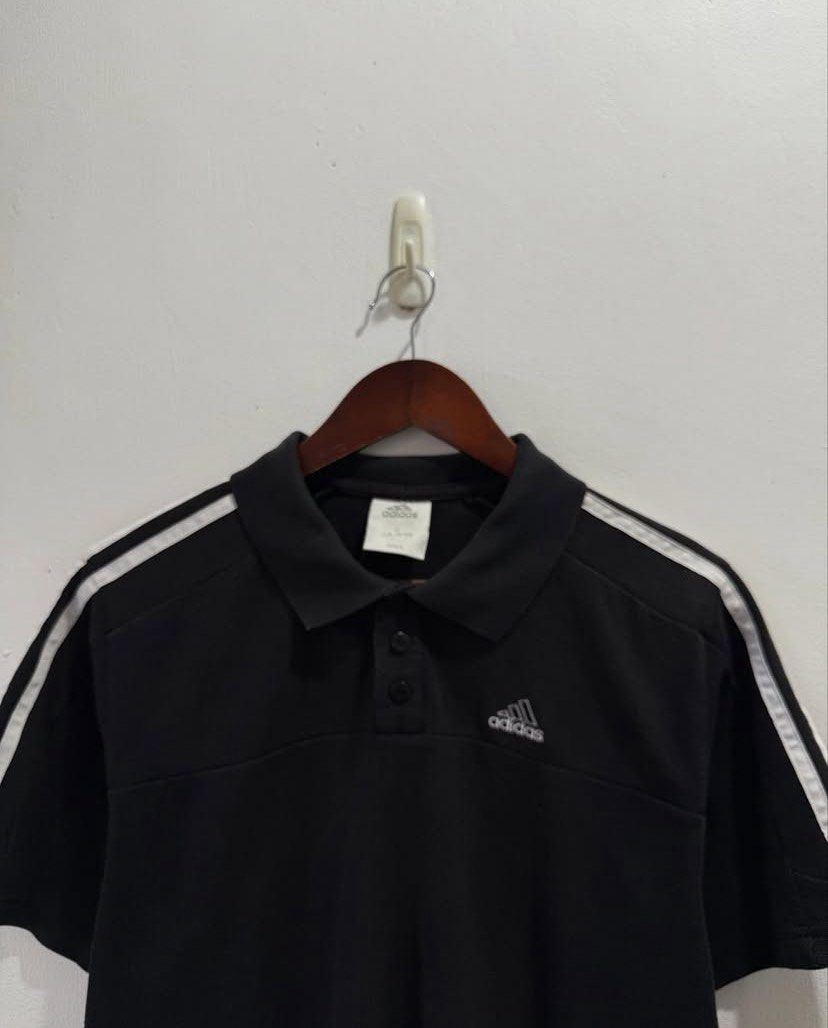 Adidas Three Stripes polo shirt (Category: Activewear) located in Calamba. Submitted by le.fleurrr_ (Listing ID 1383060230, Image 2). Description: Adidas Three Stripes Polo Shirt - size: XL but fits large (semi-cropped fit) - width: 22 - length: 26 - sleeves: 9 - color rate: 8.5/10 “only issue is Minor fading — adds a vintage look, overall in good condition” Price: ₱280 only 📍Calamba .