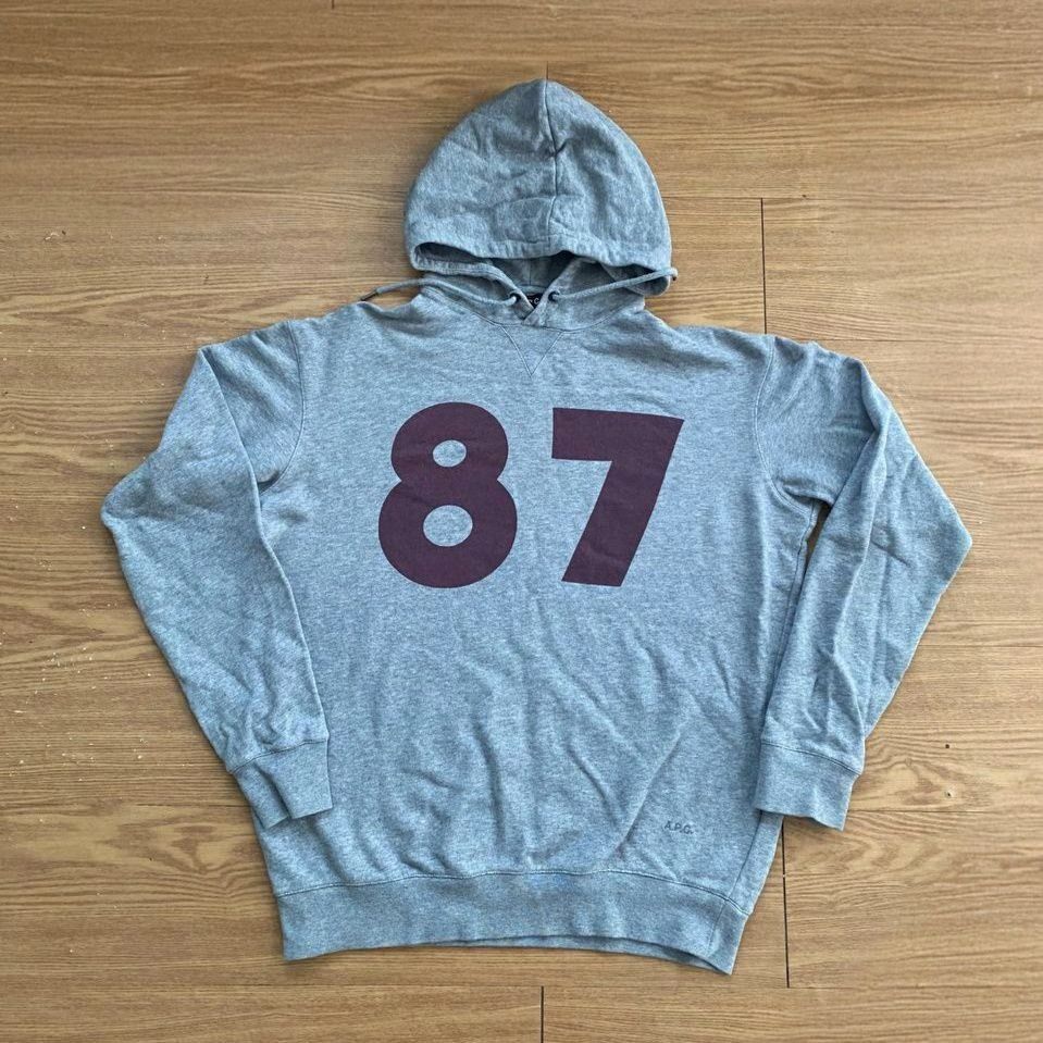 A.P.C. 25th Anniversary Hoodie (Category: Activewear) located in Manila. Submitted by Prevtheque (Listing ID 1383009289, Image 1). Description: Clean charcoal oversized hoodie with "87" on the chest. Dropped for A.P.C.'s 25th year. Super lowkey and limited W-22" L-24" NEGOTIABLE .