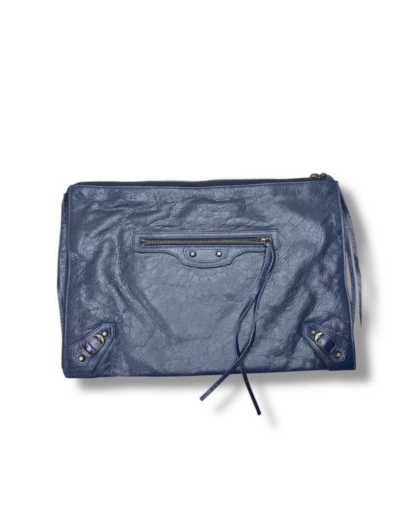 Balenciaga clutch (Category: Luxury Bags & Wallets) located in Manila. Submitted by Qratedph.pieces (Listing ID 1382954047, Image 2). Description: Balenciaga document clutch bag in blue Rank A-AB No inclusion Php 7,800 *color may vary due to lighting Disclaimer: Qratedph.pieces is not associated or affiliated with the brands featured. All copyrights and trademarks reserved to brand owners..