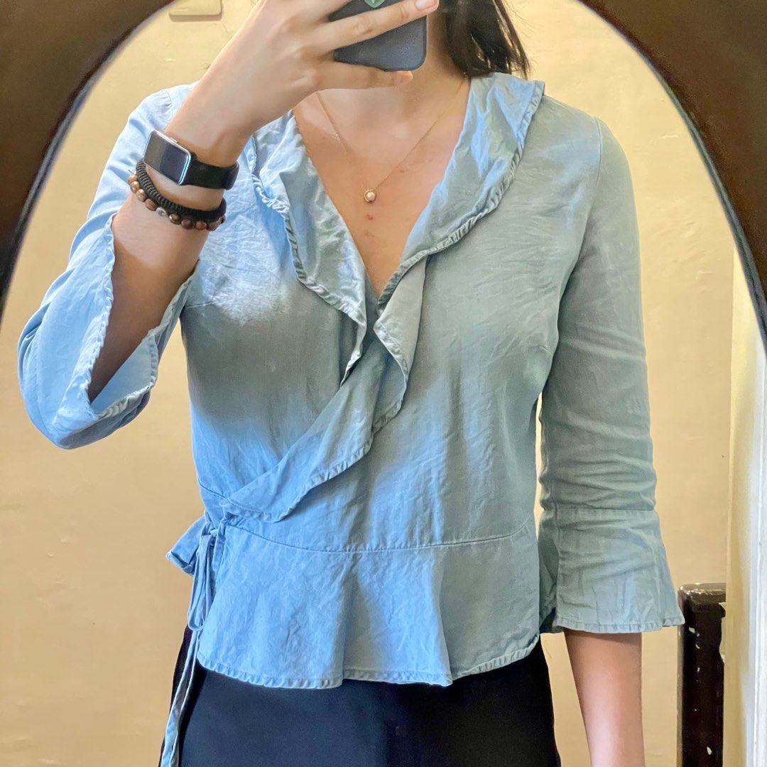 Cotton On Blue Frilly Top (Category: Blouses) located in Quezon City. Submitted by savespaces (Listing ID 1382940486, Image 1). Description: Cotton On Blue Frilly Top • size xxs-xs • lightly used, no flaws • can send more when worn thru chat • bought from Cotton On robinsons magnolia years ago rfs: gained muscles 😅 didnt fit me nicely na.