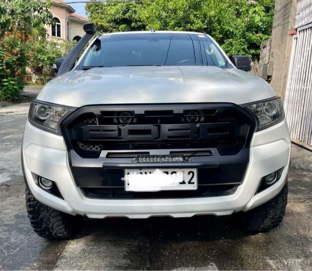 Ford Ranger (Category: Used Cars) located in Quezon City. Submitted by chrisryan (Listing ID 1382984584, Image 1). Description: For Sale 2016 Ford Ranger 4x2 XLT AT Well maintained - first owner - upgraded Shocks Ironman Nitrogas set 2 inch - 285/70/r17 Radar RT tires - Black Mamba Bronze color Rims 17 inch - Snorkel - soft trifold bed cover - Jaos mud flops - newly installed Led white low beam headlight - 90k mileage, never been used to trail or