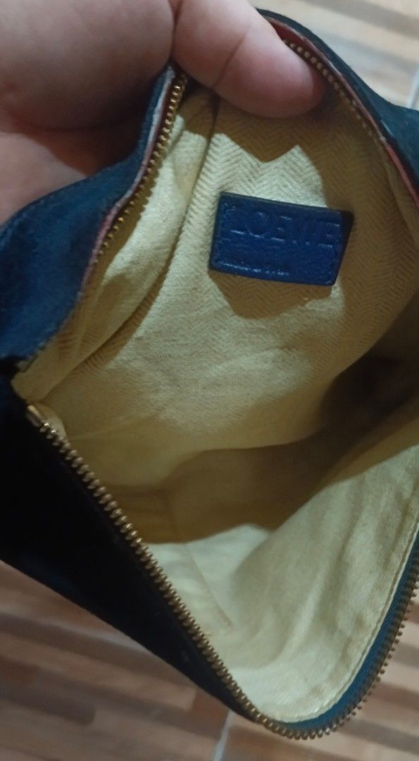 Loewe (Category: Luxury Bags & Wallets) located in Legazpi City. Submitted by georgepineda791 (Listing ID 1382884494, Image 3). Description: Loewe Leather Pochette – Preloved ✔️ Suede-like leather ✔️ YKK zipper & gold hardware ✔️ With code inside 📍Has visible signs of usage and a distinct leather smell (possibly from storage and rainy weather). 💡 Ideal for buyers who can freshen it up using leather conditioner or deodorizer. Priced low for this
