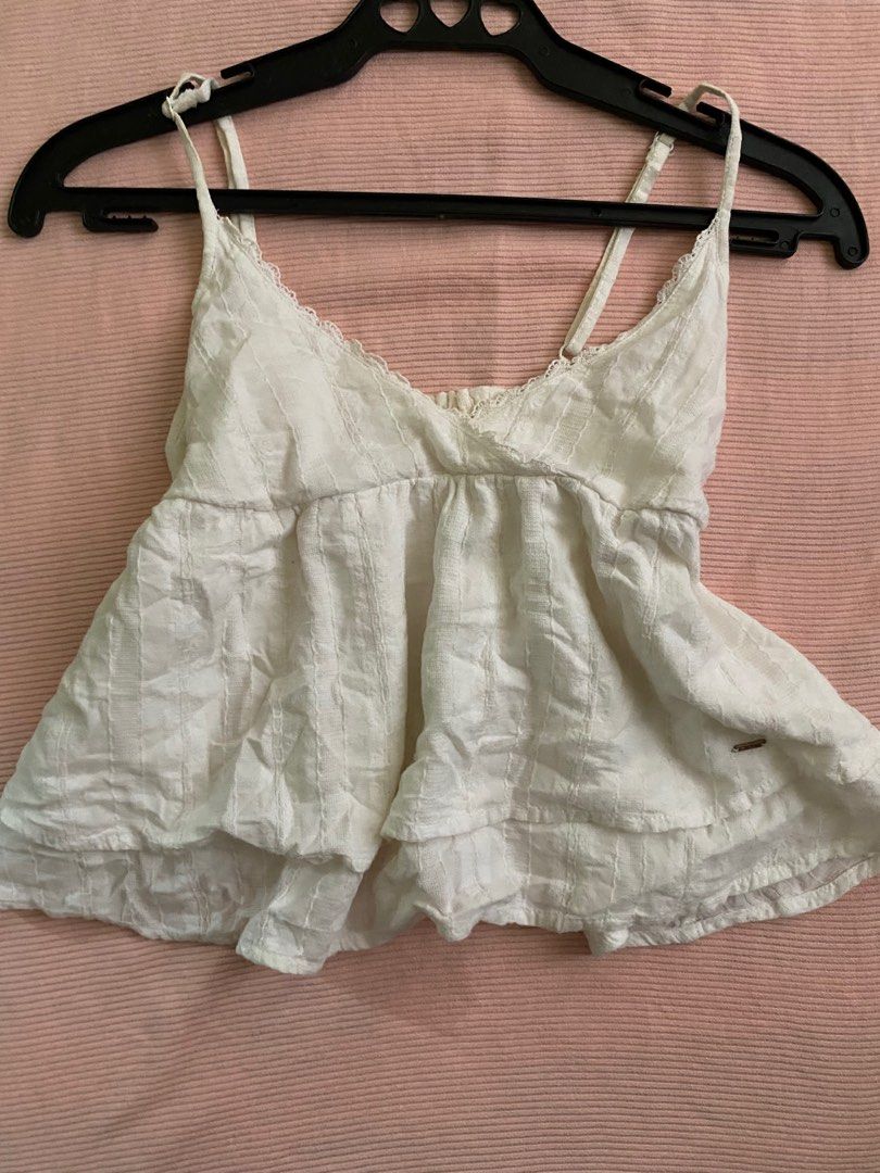 White Peplum Babydoll Top (Category: Sleeveless) located in Cabuyao City. Submitted by duiyy (Listing ID 1383065030, Image 1). Description: -has no flaws but needs washing -xs-m .