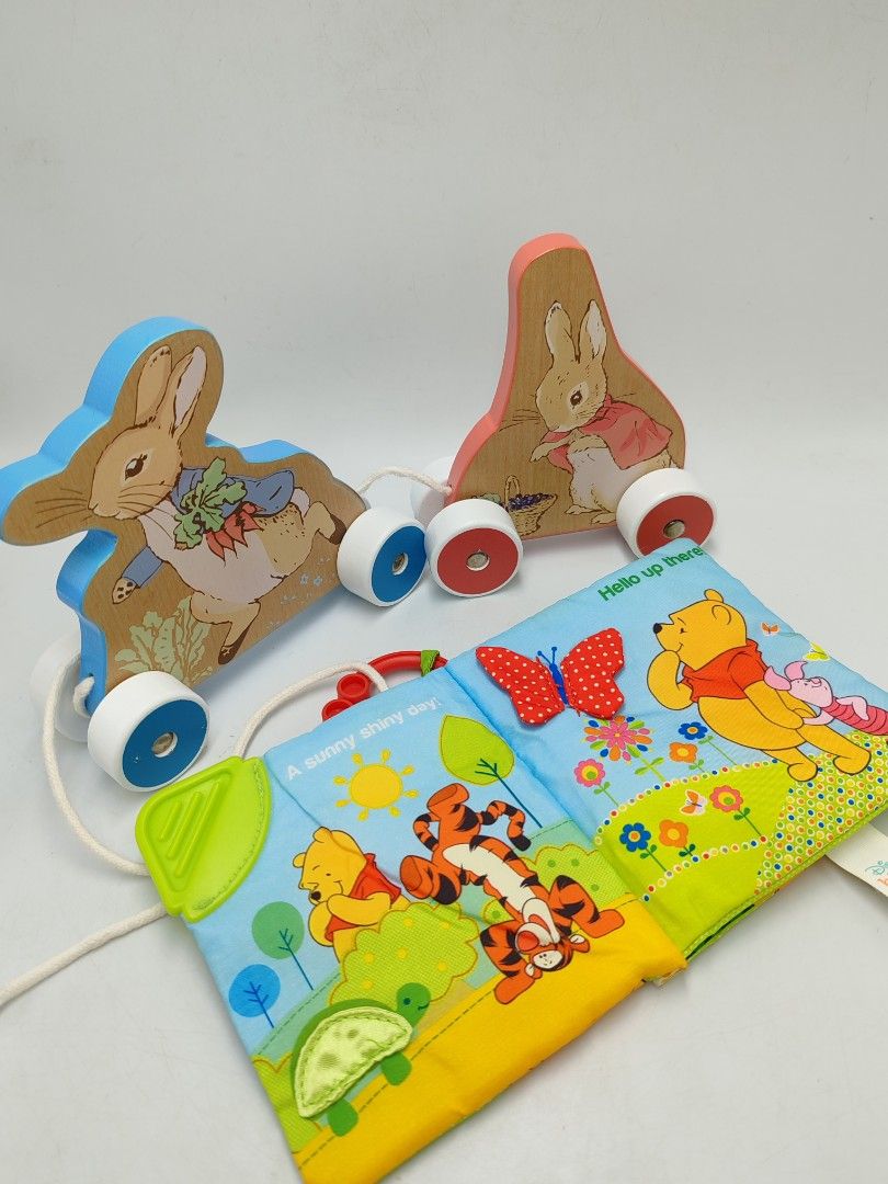 Wooden Peter Rabbit Pull & Disney Winnie The Pooh Soft Book Combo (B23) (Category: Infant Playtime) located in Muar. Submitted by magicpalsplac3 (Listing ID 1383041296, Image 1). Description: Baby combo toys The soft book can be washed/soaked.