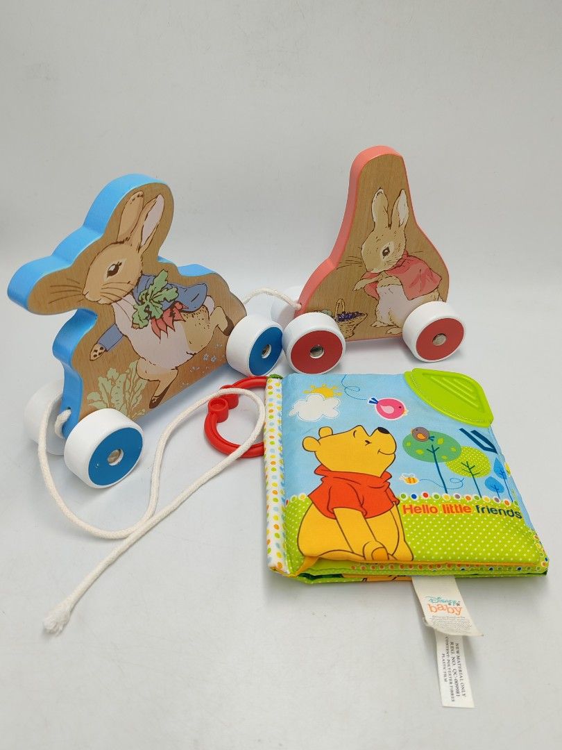 Wooden Peter Rabbit Pull & Disney Winnie The Pooh Soft Book Combo (B23) (Category: Infant Playtime) located in Muar. Submitted by magicpalsplac3 (Listing ID 1383041296, Image 2). Description: Baby combo toys The soft book can be washed/soaked.