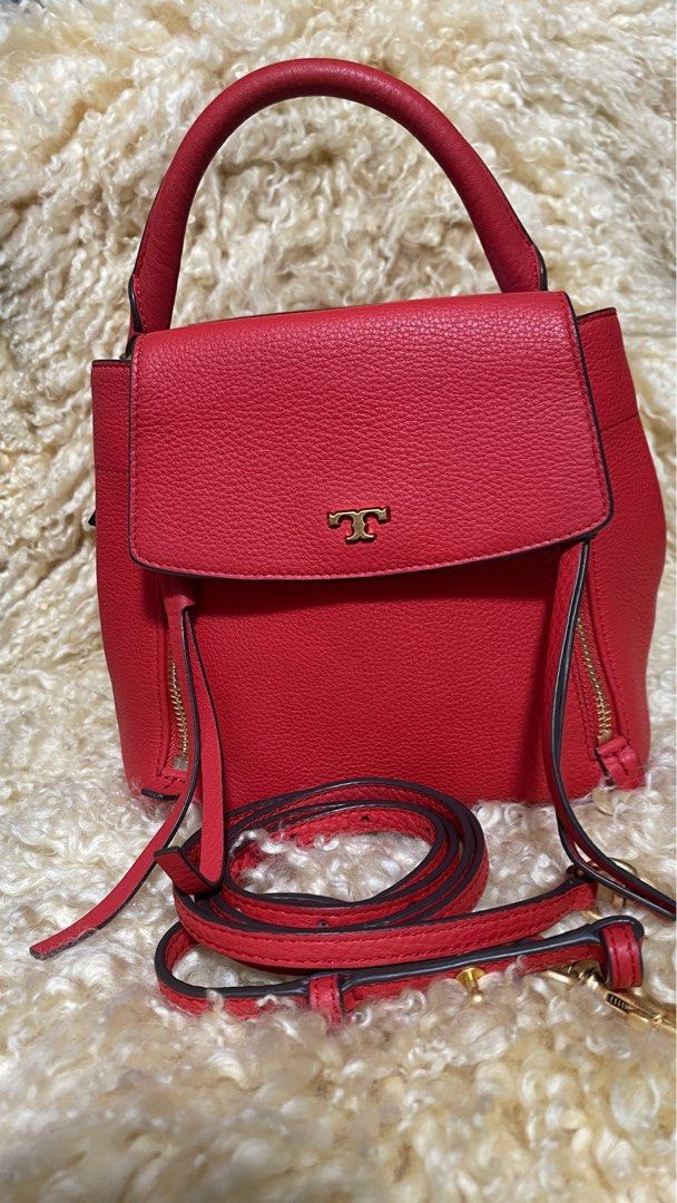 Authentic TORY BURCH HALF-MOON CROSSBODY (Category: Luxury Bags & Wallets) located in Las Pinas. Submitted by tatz06 (Listing ID 1383166296, Image 1). Description: The perfect balance of structure and easy slouch: The Half-Moon Cross-Body is a new take on a favorite shape. Made of pebbled leather, it’s detailed with double zip accents and an optional, adjustable strap. * Pebbled leather * Magnetic snap and bridge closure * Double zipper detail * 