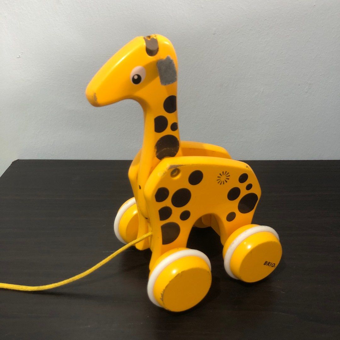 Brio Giraffe Pull Along Toy (Category: Infant Playtime) located in Imus. Submitted by dyelinn (Listing ID 1383222635, Image 1). Description: ✨PRELOVED 🇬🇧 Brio Giraffe Pull Along Toy Flaws: Paint chips and scratches; yung front wheels lang moving pag hinihila. Moving head to neck and wheels sa likod pag pinush by hand yung buong toy.
