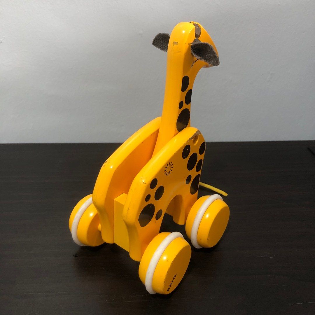 Brio Giraffe Pull Along Toy (Category: Infant Playtime) located in Imus. Submitted by dyelinn (Listing ID 1383222635, Image 3). Description: ✨PRELOVED 🇬🇧 Brio Giraffe Pull Along Toy Flaws: Paint chips and scratches; yung front wheels lang moving pag hinihila. Moving head to neck and wheels sa likod pag pinush by hand yung buong toy.