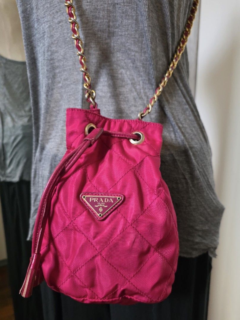 Prada Vintage Bucket Mini Sling Chain Bag (Category: Luxury Bags & Wallets) located in Cotabato. Submitted by junyamafia (Listing ID 1383094667, Image 3). Description: Tag #2 Made in Italy Super cute! Always in style! Light weight n easy to clean No ripped no tear In a good condition, might need a bit of cleaning on the edges Measurements ( Approximately) Height: 7” Width: 5.9” Length: 3.9” Strap: 16-22” 100% authentic, bought in 2nd hand shop in
