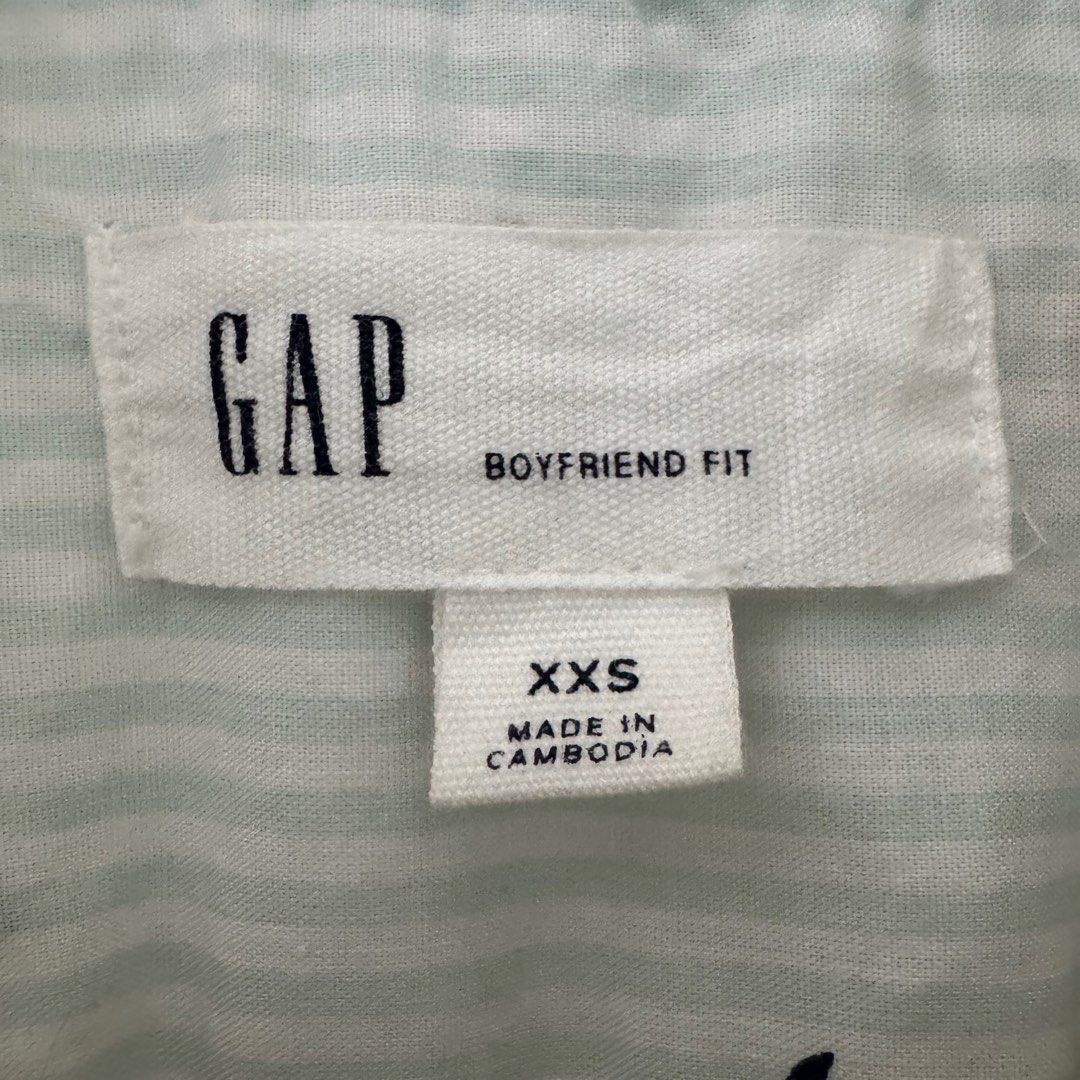 Button Down Shirt Longsleeves (Category: Longsleeves) located in Quezon City. Submitted by 2ndtake (Listing ID 1383297231, Image 3). Description: Gap Women’s Button Down Shirt with light blue and white striped pattern and has small red cherry motifs. The shirt is long-sleeved with button cuffs and a classic collar. Lightweight, breathable fabric, cotton, suitable for layering or wearing on its own. The front features a button closure, and it has 