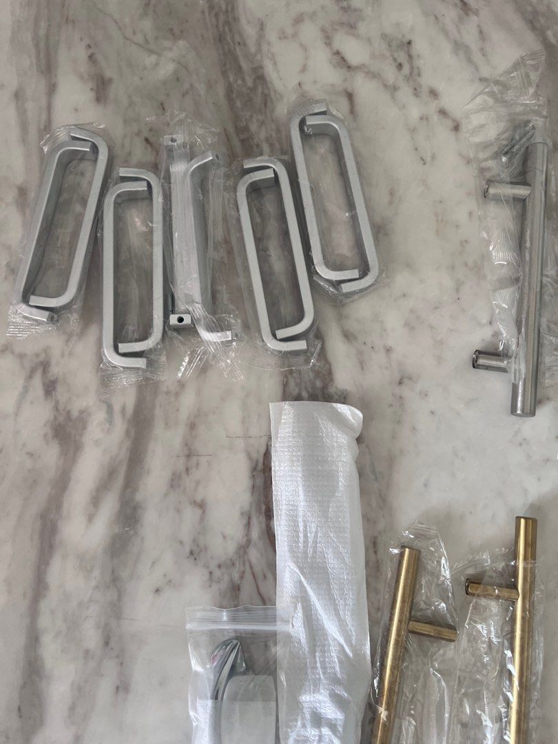 Cabinet Hardware - Knobs, Pulls, and Handles (Category: Home Improvement Tools & Accessories) located in Singapore. Submitted by adityd (Listing ID 1383313400, Image 3). Description: Assorted cabinet hardware including knobs, pulls, and handles in various styles and finishes. Includes crystal knobs, gold and silver pulls, and more. All items are new and in original packaging. Perfect for updating your kitchen or bathroom cabinets..