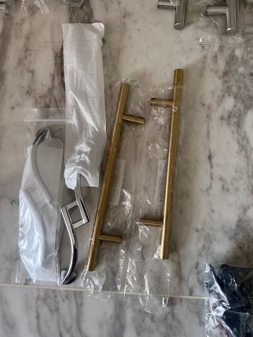 Cabinet Hardware - Knobs, Pulls, and Handles (Category: Home Improvement Tools & Accessories) located in Singapore. Submitted by adityd (Listing ID 1383313400, Image 1). Description: Assorted cabinet hardware including knobs, pulls, and handles in various styles and finishes. Includes crystal knobs, gold and silver pulls, and more. All items are new and in original packaging. Perfect for updating your kitchen or bathroom cabinets..
