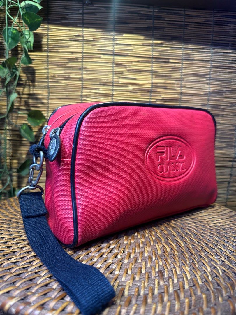 FILA Red Sport clutch Bag (Category: Luxury Bags & Wallets) located in Quezon City. Submitted by whatsinmyclosett (Listing ID 1383456920, Image 2). Description: FILA Red Sport clutch Bag ☑️Made in Japan ☑️Original ☑️Vintage ☑️branded ☑️ 27 X 16 CM ☑️ GOOD CONDITION !! ☑️Manage your Expectations this is Second hand Item/ Vintage Item Hindi Brand New Binibili mo 🔴 normal sign of usage lang..pls check the photos 🔴BAWAL NA BAWAL SA MAARTE.. 🔴NO RE