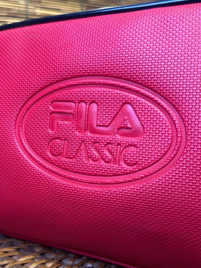 FILA Red Sport clutch Bag (Category: Luxury Bags & Wallets) located in Quezon City. Submitted by whatsinmyclosett (Listing ID 1383456920, Image 3). Description: FILA Red Sport clutch Bag ☑️Made in Japan ☑️Original ☑️Vintage ☑️branded ☑️ 27 X 16 CM ☑️ GOOD CONDITION !! ☑️Manage your Expectations this is Second hand Item/ Vintage Item Hindi Brand New Binibili mo 🔴 normal sign of usage lang..pls check the photos 🔴BAWAL NA BAWAL SA MAARTE.. 🔴NO RE