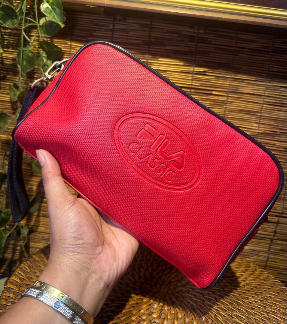 FILA Red Sport clutch Bag (Category: Luxury Bags & Wallets) located in Quezon City. Submitted by whatsinmyclosett (Listing ID 1383456920, Image 1). Description: FILA Red Sport clutch Bag ☑️Made in Japan ☑️Original ☑️Vintage ☑️branded ☑️ 27 X 16 CM ☑️ GOOD CONDITION !! ☑️Manage your Expectations this is Second hand Item/ Vintage Item Hindi Brand New Binibili mo 🔴 normal sign of usage lang..pls check the photos 🔴BAWAL NA BAWAL SA MAARTE.. 🔴NO RE