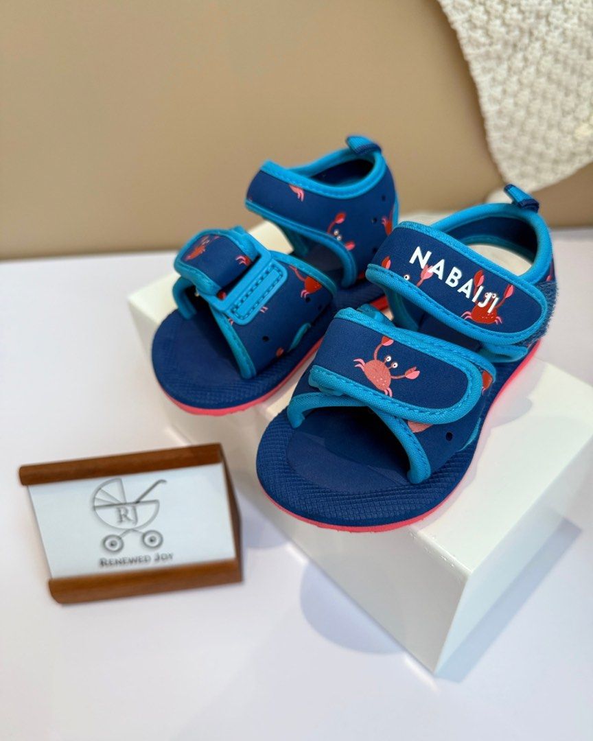 NABAIJI baby swimming sandals (Category: Babies & Kids Fashion) located in Kuala Lumpur. Submitted by renewedjoymy (Listing ID 1383420515, Image 1). Description: NABAIJI baby swimming sandals | KF004 🍼 pool sandals for small children walking around the pool or near water 🍼 comfortable, lightweight, with a colourful print are designed to keep the foot firmly in place, thanks to the 2 rip-tab straps 🍼 grooved sole for grip on the ground 🍼 size 