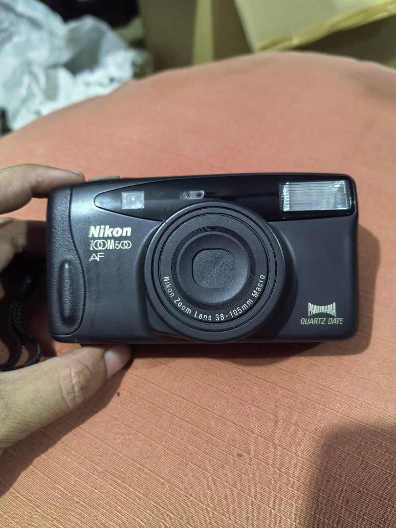 NIKON Zoom 500 AF (Category: Cameras) located in Cebu City. Submitted by dudes_villanueva (Listing ID 1383388292, Image 1). Description: NIKON Zoom 500 AF 📌Compact, fully automated 35mm point-and-shoot film camera. 📌Lens: It features a Nikon Zoom Lens 38-105mm f/3.5-9.2. 📌Features: Quartz Date function for imprinting the date on photos and a Panorama function for capturing wider images. 📌Power Source: It requires one 3V CR123A (or DL123) lith