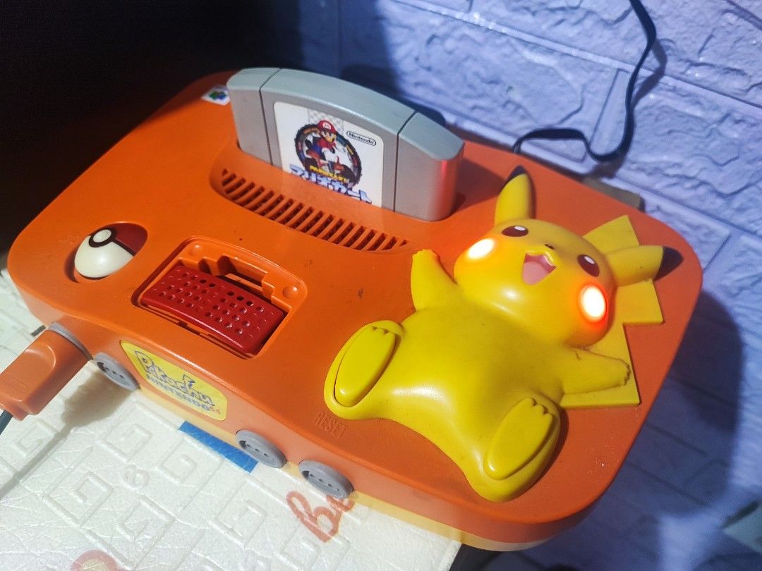 Rare N64 Pikachu Edition (JP) (Category: Nintendo) located in Valenzuela. Submitted by retrogears (Listing ID 1383400676, Image 1). Description: N64 Pikachu Edition With Box (JP Unit) Collector item. Inclusions Unit 1 controller pikachu edition (working) Power Brick 110v AV to HDMI cable Expansion Pak Jumper Pak Extra controller - Pikachu edition ( defective, paayos niyo na lang) 3 Games Mariokart donkey kong Pokemon Snap Box condition is not min