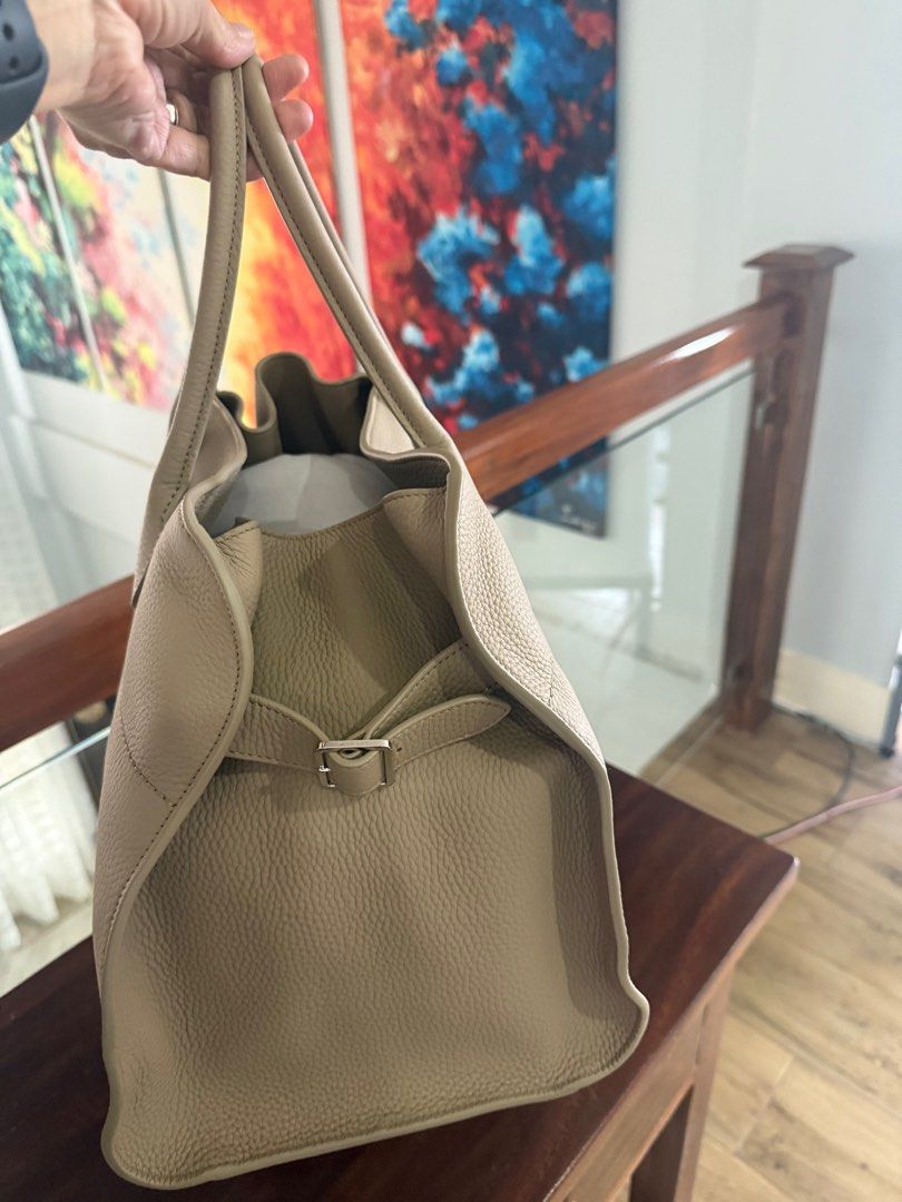 The Row Bag Soft Margaux 15 (Category: Luxury Bags & Wallets) located in Tagaytay City. Submitted by prelovedbytmj (Listing ID 1383336783, Image 3). Description: THE ROW BAG Crafted with precision from smooth genuine cowhide leather, the Row Bag is a perfect fusion of function, form, and style. Its sleek, cinched design with adjustable belted sides creates a distinctive silhouette, while the spacious interior ensures practicality for everyday use