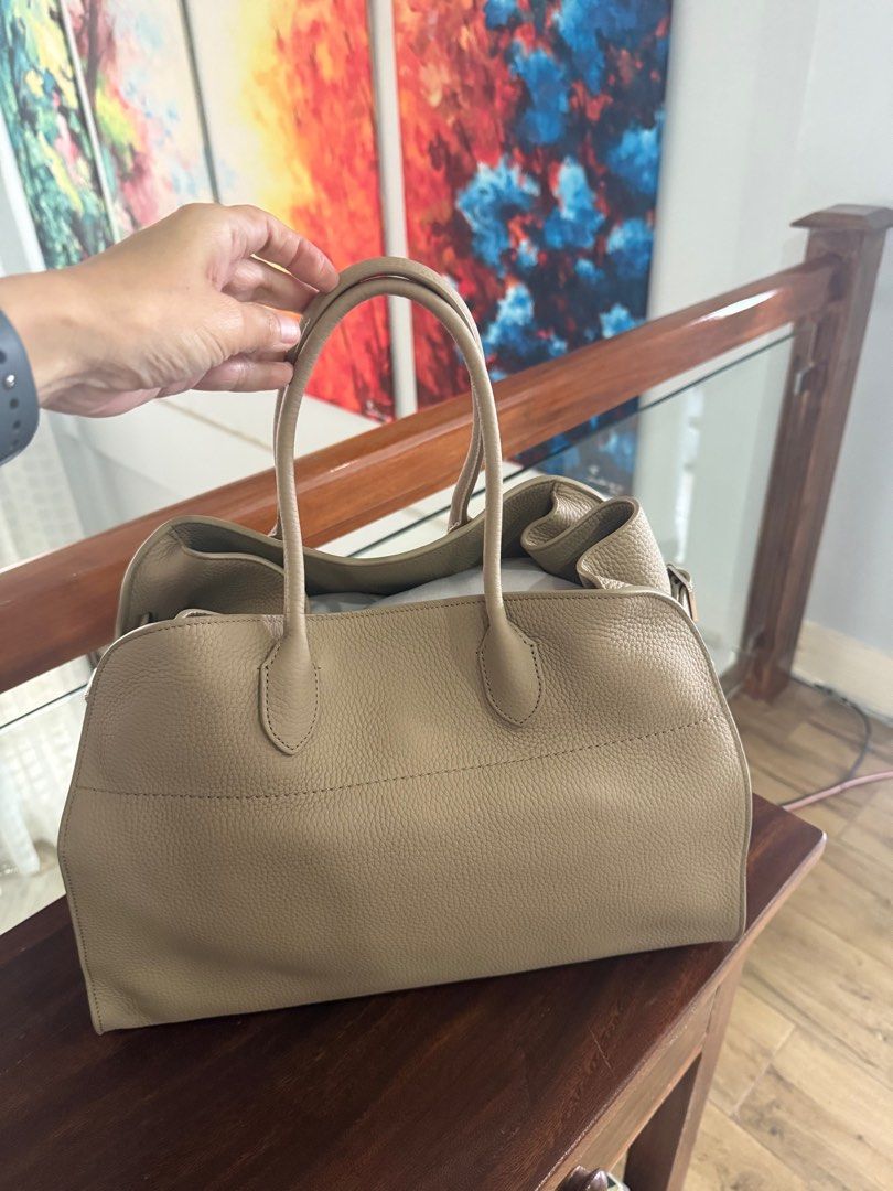 The Row Bag Soft Margaux 15 (Category: Luxury Bags & Wallets) located in Tagaytay City. Submitted by prelovedbytmj (Listing ID 1383336783, Image 2). Description: THE ROW BAG Crafted with precision from smooth genuine cowhide leather, the Row Bag is a perfect fusion of function, form, and style. Its sleek, cinched design with adjustable belted sides creates a distinctive silhouette, while the spacious interior ensures practicality for everyday use