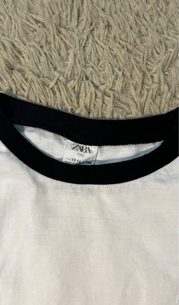 Zara Kids White T-shirt (Category: Babies & Kids Fashion) located in Kuala Lumpur. Submitted by nizamfarhan187 (Listing ID 1383288333, Image 2). Description: Zara T-shirt, Kids size 13-14 y/o, light stain on the front.