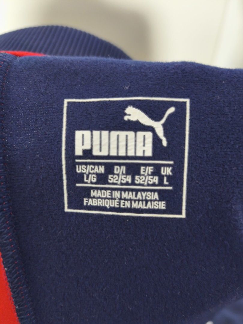 Arsenal Puma Jacket 2017/18 – Size L (Category: Coats, Jackets and Outerwear) located in Kuala Lumpur. Submitted by hfiydanish14488 (Listing ID 1383570957, Image 3). Description: Official Arsenal FC Puma jacket from the 2017/2018 season. Features Fly Emirates sponsor and classic red-blue colorway. Size L. Made in Malaysia. Good condition, lightly used with no major defects. Great for collectors or fans. (Can nego).
