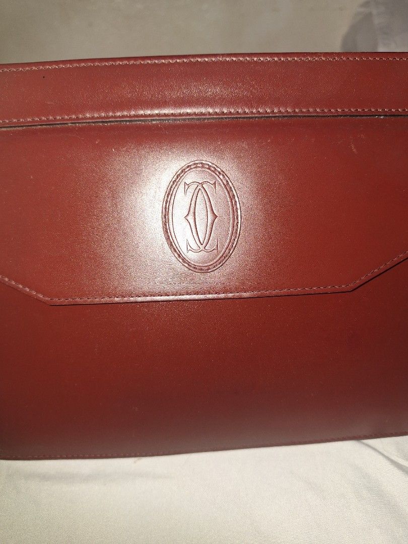 Authentic Cartier Red Leather Clutch Bag (Category: Luxury Bags & Wallets) located in Calatagan. Submitted by zigi_finds (Listing ID 1383586337, Image 3). Description: Authentic vintage Cartier bag bought in Japan. Selling as I need funds and don't use as much. Free shipping. Newly cleaned, polished, and sanitized, faded zipper head but otherwise in good, preloved condition. Dm for questions or additional pics!.