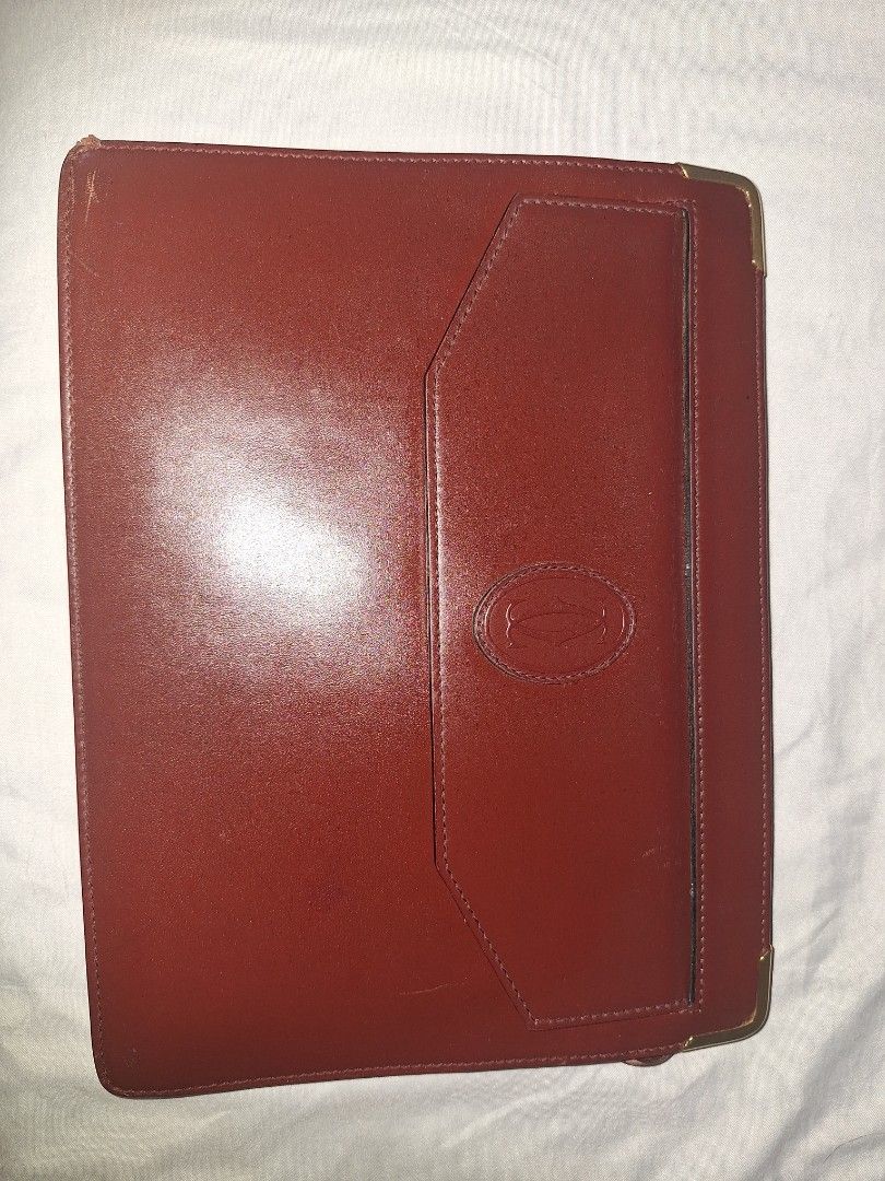 Authentic Cartier Red Leather Clutch Bag (Category: Luxury Bags & Wallets) located in Calatagan. Submitted by zigi_finds (Listing ID 1383586337, Image 2). Description: Authentic vintage Cartier bag bought in Japan. Selling as I need funds and don't use as much. Free shipping. Newly cleaned, polished, and sanitized, faded zipper head but otherwise in good, preloved condition. Dm for questions or additional pics!.