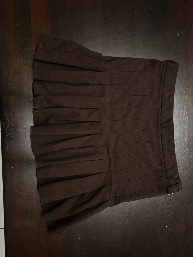 Dark choco brown pleated mini skirt (Category: Skirts) located in Calamba. Submitted by scarletshops (Listing ID 1383661793, Image 2). Description: Great condition DM for dimes.