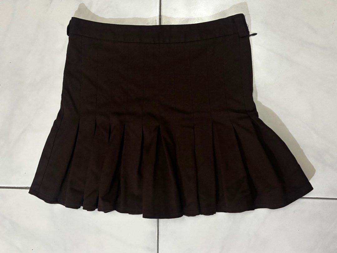 Dark choco brown pleated mini skirt (Category: Skirts) located in Calamba. Submitted by scarletshops (Listing ID 1383661793, Image 1). Description: Great condition DM for dimes.